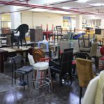 Basement filled with wooden and plastic chairs