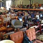 Iron built room filled with old used different types of chairs