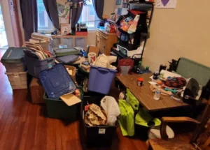 room containing old furniture table, baskets and chairs